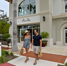 couple walking venice main street in florida shopping